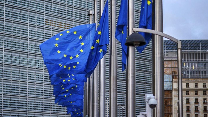 The European flag, left, flies at half mast in front of the Council of Europe, in honor of Britains Queen Elizabeth II after her death on Thursday at the age of 96, in Strasbourg, eastern France, Friday, Sept. 9, 2022. (AP Photo/Jean-Francois Badias)