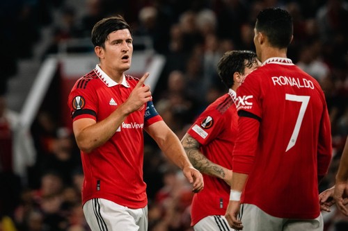MANCHESTER, ENGLAND - SEPTEMBER 08:   Harry Maguire of Manchester United reacts to Cristiano Ronaldo  during the UEFA Europa League group E match between Manchester United and Real Sociedad at Old Trafford on September 8, 2022 in Manchester, United Kingdom. (Photo by Ash Donelon/Manchester United via Getty Images)