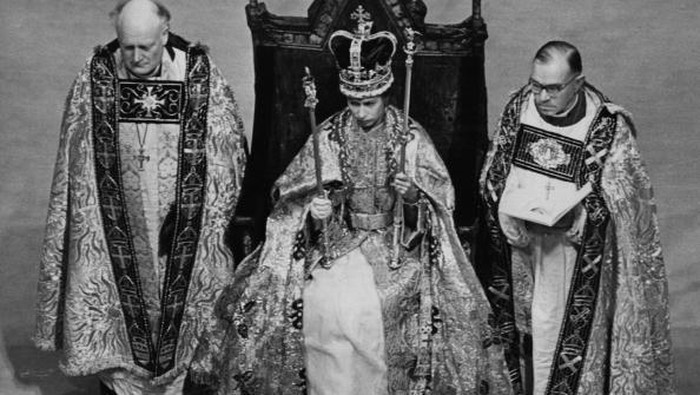 2nd June 1953:  Queen Elizabeth II in the coronation coach on her way to be crowned at Westminster Abbey. She is dressed as a peeress of the realm and wears the Diadem crown.