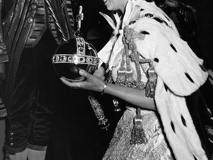 2nd June 1953:  Queen Elizabeth II in the coronation coach on her way to be crowned at Westminster Abbey. She is dressed as a peeress of the realm and wears the Diadem crown.