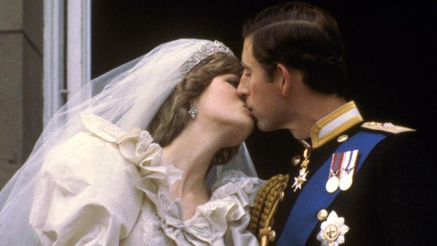 FILE - In this July 29, 1981 file photo, Britain's Prince Charles kisses his bride, Princess Diana, on the balcony of Buckingham Palace in London, after their wedding. Prince Charles has been preparing for the crown his entire life. Now, that moment has finally arrived. Charles, the oldest person to ever assume the British throne, became king on Thursday Sept. 8, 2022, following the death of his mother, Queen Elizabeth II. (AP Photo, File)