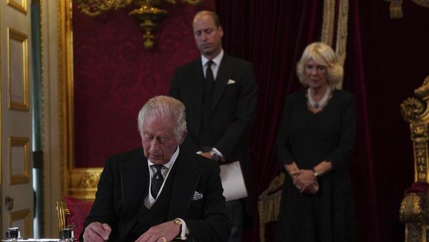 King Charles III signs an oath to uphold the security of the Church in Scotland during the Accession Council at St James's Palace, London, Saturday, Sept. 10, 2022, where King Charles III is formally proclaimed monarch. (Victoria Jones/Pool Photo via AP)