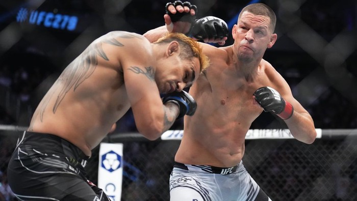 LAS VEGAS, NEVADA - SEPTEMBER 10: (R-L) Nate Diaz punches Tony Ferguson in a welterweight fight during the UFC 279 event at T-Mobile Arena on September 10, 2022 in Las Vegas, Nevada. (Photo by Chris Unger/Zuffa LLC)