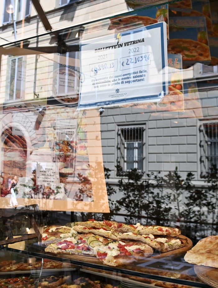 1243158328 FLORENCE, ITALY - SEPTEMBER 10: A photo shows a bill on display outside a restaurant as restaurant, cafe and bar owners seek urgent help from government after seeing their energy costs triple from a year earlier due to the ongoing energy crisis in Florence, Italy on September 10, 2022. Struggling to cope with soaring energy prices, bar and restaurant owners across Italy have decided to share their pain with their customers, putting their âunbearableâ gas and electricity bills on display. The nationwide âBollette in Vetrinaâ (Bills on Display) initiative was launched by Fipe-Confcommercio â the Italian association of retail and catering businesses â with the aim of making customers aware of the grim reality: energy bills have tripled compared to a year ago. The heavy toll from the ongoing energy crisis â a consequence of the Ukrainian war and Russiaâs cutting of gas supplies to Europe â is forcing small and medium-sized retailers to choose between imposing price increases on their clients or shutting down. (Photo by Carlo Bressan/Anadolu Agency via Getty Images)