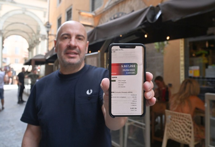 1243158328 FLORENCE, ITALY - SEPTEMBER 10: A photo shows a bill on display outside a restaurant as restaurant, cafe and bar owners seek urgent help from government after seeing their energy costs triple from a year earlier due to the ongoing energy crisis in Florence, Italy on September 10, 2022. Struggling to cope with soaring energy prices, bar and restaurant owners across Italy have decided to share their pain with their customers, putting their âunbearableâ gas and electricity bills on display. The nationwide âBollette in Vetrinaâ (Bills on Display) initiative was launched by Fipe-Confcommercio â the Italian association of retail and catering businesses â with the aim of making customers aware of the grim reality: energy bills have tripled compared to a year ago. The heavy toll from the ongoing energy crisis â a consequence of the Ukrainian war and Russiaâs cutting of gas supplies to Europe â is forcing small and medium-sized retailers to choose between imposing price increases on their clients or shutting down. (Photo by Carlo Bressan/Anadolu Agency via Getty Images)