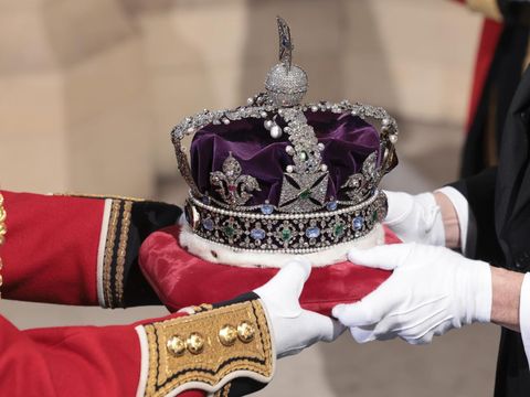 The Imperial State Crown arrives through the Sovereign's Entrance ahead of the State Opening of Parliament at Houses of Parliament in London, Tuesday, May 10, 2022. Britain’s Parliament opens a new year-long session on Tuesday with a mix of royal pomp and raw politics, as Prime Minister Boris Johnson tries to re-energize his scandal-tarnished administration and revive the economy amid a worsening cost-of-living crisis. (Chris Jackson/Pool Photo via AP)