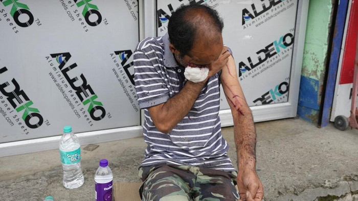 India Kashmir Animal Attack A Kashmir wildlife official holds a tranquilizer dart as they search for a wild bear after a civilian was injured in its attack in Srinagar, Indian controlled Kashmir, Sunday, Sept. 11, 2022. (AP Photo/Mukhtar Khan)