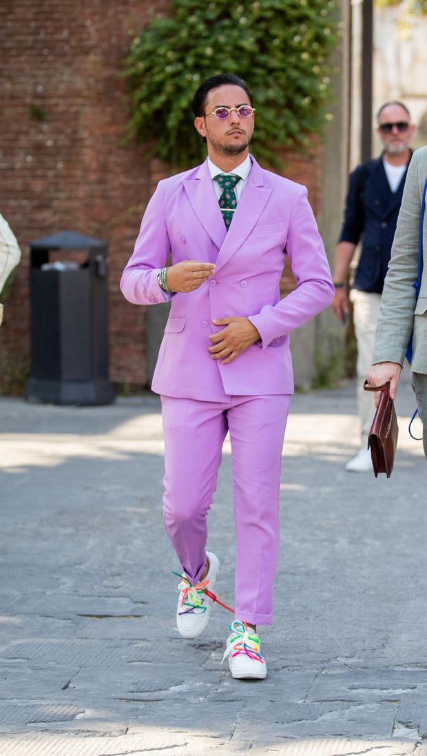 FLORENCE, ITALY - JUNE 14: A guest is seen wearing pink double breasted blazer, pants & a guest wearing blazer, pants at the Pitti Immagine Uomo 102 at Fortezza Da Basso on June 14, 2022 in Florence, Italy. (Photo by Christian Vierig/Getty Images)