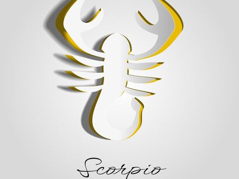 Scorpio, zodiac symbol on cut paper or carved paper