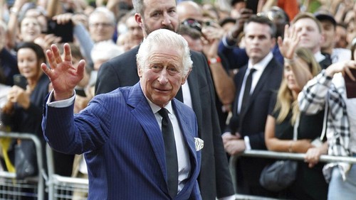 King Charles III greets members of the public outside Clarence House in London after he was formally proclaimed monarch by the Privy Council, Saturday Sept. 10, 2022. ( James Manning/PA via AP)