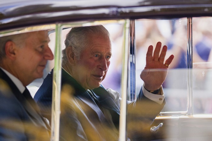 King Charles III greets supporters as he arrives at Buckingham Palace in London, Sunday, Sept. 11, 2022. Queen Elizabeth II, Britains longest-reigning monarch and a rock of stability across much of a turbulent century, died Thursday Sept. 8, 2022, after 70 years on the throne. She was 96. (AP Photo/Emilio Morenatti)