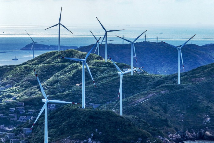 ZHOUSHAN, CHINA - SEPTEMBER 10: Aerial view of wind turbines at a wind farm on East Lvhua Island on September 10, 2022 in Zhoushan, Zhejiang Province of China. (Photo by Yao Feng/VCG via Getty Images)