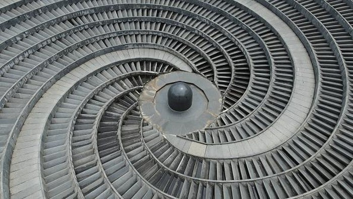 NANNING, CHINA - SEPTEMBER 12, 2022 - An aerial photo shows an ultra-modern giant circular mysterious fountain whirlpool at Jinhu Square in Nanning, South China's Guangxi Zhuang autonomous region, Sept 12, 2022. From the air, the spiral steps twist and rotate, interlocking, just like a profound 