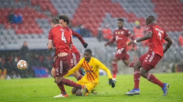 MUNICH, GERMANY - DECEMBER 8: Niklas Suele of FCB, Ousmane Dembflf of FC Barcelona in action during the UEFA Champions League Football Match between Fc Bayern vs Fc Barcelona at Stadium Munich Allianz Arena on December 8, 2021 in Munich, Germany. (Photo by Martin Hangen ATPImages/Getty Images)