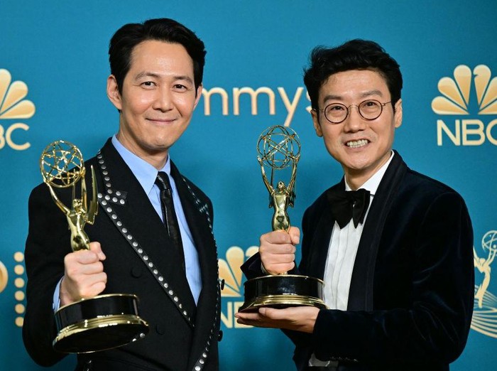 South Korean actor Lee Jung-jae (L) poses with the award for Outstanding Lead Actor In A Drama Series and South Korean director Hwang Dong-hyuk (R) with the Emmy for Outstanding Directing For A Drama Series for Squid Game during the 74th Emmy Awards at the Microsoft Theater in Los Angeles, California, on September 12, 2022. (Photo by Frederic J. Brown / AFP) (Photo by FREDERIC J. BROWN/AFP via Getty Images)