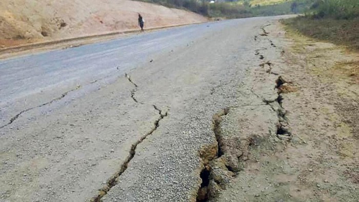 Debris lies strewn across a highway following a landslide near the town of Kainantu, following a 7.6-magnitude earthquake in northeastern Papua New Guinea, Sunday, Sept. 11, 2022. The quake hit at 9:46 a.m. local time, with the epicenter 67 kilometers (42 miles) east of Kainantu, a sparsely populated area. (Renagi Ravu via AP)