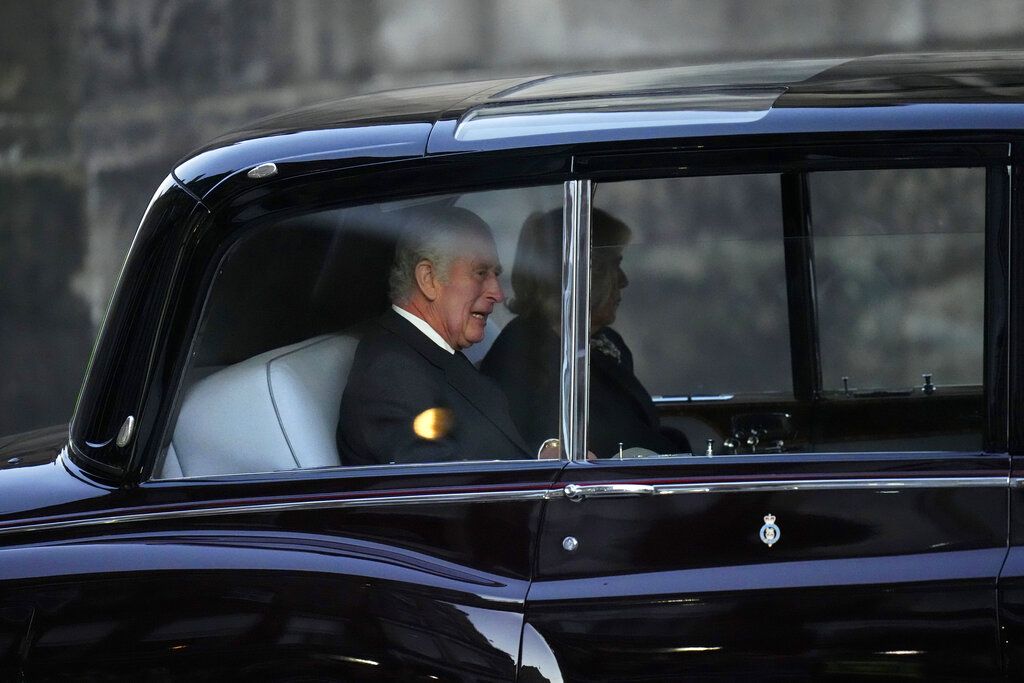 King Charles III, rear seat left, leaves St Giles' Cathedral after a thanksgiving service for late Queen Elizabeth II, in Edinburgh, Monday, Sept. 12, 2022. Britain's longest-reigning monarch who was a rock of stability across much of a turbulent century, died Thursday Sept. 8, 2022, after 70 years on the throne. She was 96. (AP Photo/Scott Heppell)