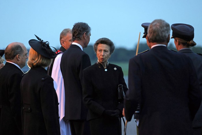 LONDON, ENGLAND  - SEPTEMBER 13: Britain's Princess Anne, Princess Royal as the coffin of Queen Elizabeth II is carried to the waiting hearse at the Royal Air Force Northolt airbase on September 13, 2022 in London, England. The coffin carrying Her Majesty Queen Elizabeth II leaves St Giles Church travelling to Edinburgh Airport where it will be flown to London and transferred to Buckingham Palace by road. Queen Elizabeth II died at Balmoral Castle in Scotland on September 8, 2022, and is succeeded by her eldest son, King Charles III. (Photo by Jack Hill - WPA Pool/Getty Images)
