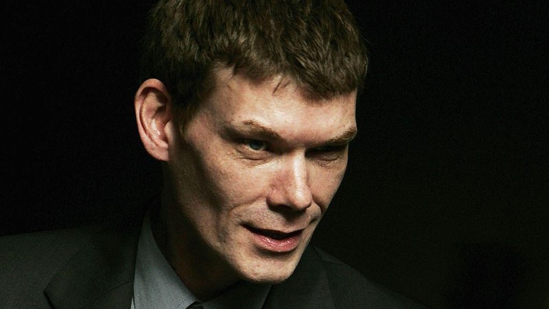 LONDON - JUNE 8: Gary McKinnon leaves Bow Street Magistrate Court in a police van after being released on bail, June 8, 2005 in London, England.  Mr McKinnon, 39, known on the internet as 