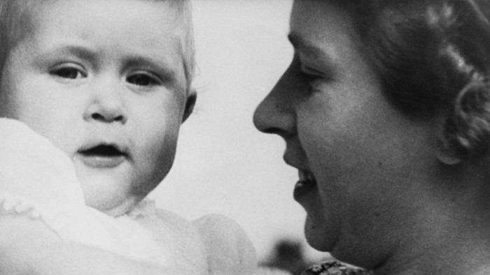 Queen Elizabeth II with her son Prince Charles, at the European Horse Trials in Windsor Great Park, 17th May 1955. The prince is covering his eyes with his gloves. (Photo by Meager/Fox Photos/Hulton Archive/Getty Images)