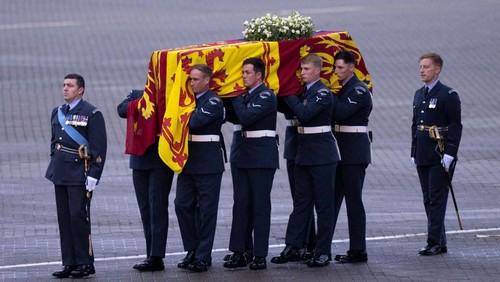 UNSPECIFIED - SEPTEMBER 13: The coffin of Queen Elizabeth II is carried off a plane by the Queens Colour Squadron at RAF Northolt on September 13, 2022 in London, United Kingdom. The coffin carrying Her Majesty Queen Elizabeth II leaves St Giles Church travelling to Edinburgh Airport where it will be flown to London and transferred to Buckingham Palace by road. Queen Elizabeth II died at Balmoral Castle in Scotland on September 8, 2022, and is succeeded by her eldest son, King Charles III.