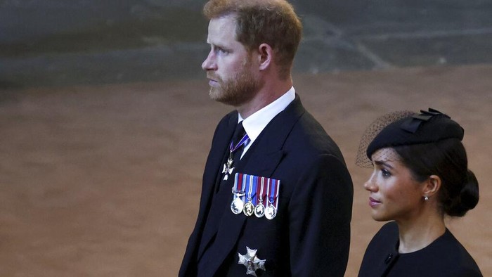 Britains Kate, Princess of Wales, from left, Prince William, Meghan, Duchess of Sussex and Prince Harry stand in Westminster Hall after participating in the procession of the coffin of Queen Elizabeth, London, Wednesday, Sept. 14, 2022. The Queen will lie in state in Westminster Hall for four full days before her funeral on Monday Sept. 19. (AP Photo/Gregorio Borgia, Pool)
