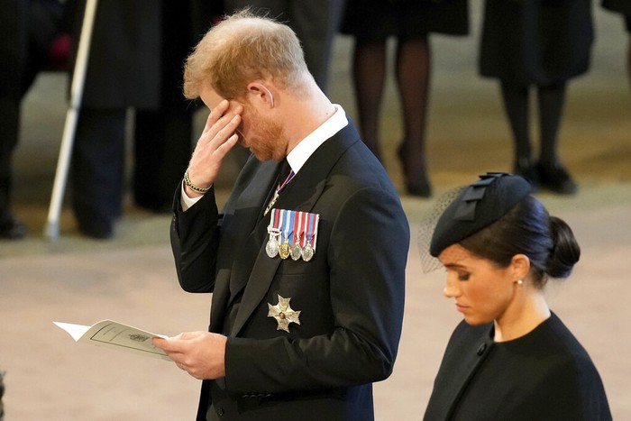 Britain's Kate, Princess of Wales, from left, Prince William, Meghan, Duchess of Sussex and Prince Harry stand in Westminster Hall after participating in the procession of the coffin of Queen Elizabeth, London, Wednesday, Sept. 14, 2022. The Queen will lie in state in Westminster Hall for four full days before her funeral on Monday Sept. 19. (AP Photo/Gregorio Borgia, Pool)