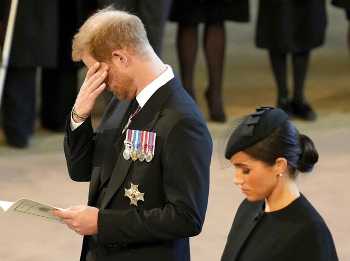 Britains Kate, Princess of Wales, from left, Prince William, Meghan, Duchess of Sussex and Prince Harry stand in Westminster Hall after participating in the procession of the coffin of Queen Elizabeth, London, Wednesday, Sept. 14, 2022. The Queen will lie in state in Westminster Hall for four full days before her funeral on Monday Sept. 19. (AP Photo/Gregorio Borgia, Pool)