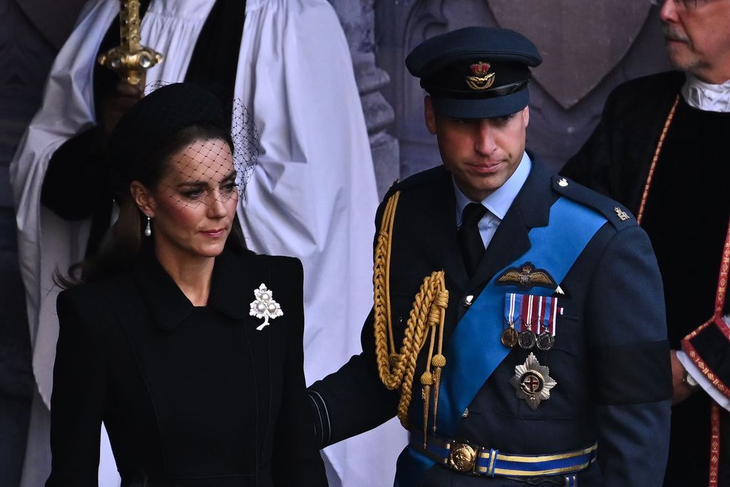 LONDON, ENGLAND - SEPTEMBER 14:  Catherine, Princess of Wales and Prince William, Prince of Wales leave after a service for the reception of Queen Elizabeth II's coffin at Westminster Hall, on September 14, 2022 in London, United Kingdom. Queen Elizabeth II's coffin is taken in procession on a Gun Carriage of The King's Troop Royal Horse Artillery from Buckingham Palace to Westminster Hall where she will lay in state until the early morning of her funeral. Queen Elizabeth II died at Balmoral Castle in Scotland on September 8, 2022, and is succeeded by her eldest son, King Charles III. (Photo by Ben Stansall - WPA Pool/Getty Images)
