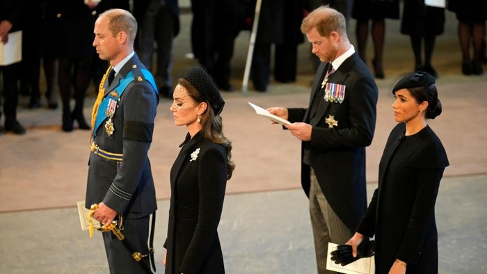LONDON, ENGLAND - SEPTEMBER 14: Prince William, Prince of Wales, Catherine, Princess of Wales, Prince Harry, Duke of Sussex and Meghan, Duchess of Sussex seen inside the Palace of Westminster during the Lying-in State of Queen Elizabeth II on September 14, 2022 in London, England. Queen Elizabeth IIs coffin is taken in procession on a Gun Carriage of The Kings Troop Royal Horse Artillery from Buckingham Palace to Westminster Hall where she will lay in state until the early morning of her funeral. Queen Elizabeth II died at Balmoral Castle in Scotland on September 8, 2022, and is succeeded by her eldest son, King Charles III.  (Photo by Christopher Furlong/Getty Images)