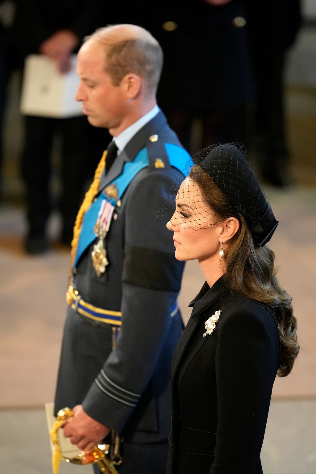 LONDON, ENGLAND - SEPTEMBER 14: Prince William, Prince of Wales and Catherine, Princess of Wales pay their respects in The Palace of Westminster during the procession for the Lying-in State of Queen Elizabeth II on September 14, 2022 in London, England. Queen Elizabeth II's coffin is taken in procession on a Gun Carriage of The King's Troop Royal Horse Artillery from Buckingham Palace to Westminster Hall where she will lay in state until the early morning of her funeral. Queen Elizabeth II died at Balmoral Castle in Scotland on September 8, 2022, and is succeeded by her eldest son, King Charles III.  (Photo by Christopher Furlong/Getty Images)