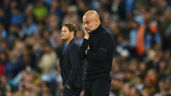 MANCHESTER, ENGLAND - SEPTEMBER 14: Pep Guardiola, Manager of Manchester City looks dejected during the UEFA Champions League group G match between Manchester City and Borussia Dortmund at Etihad Stadium on September 14, 2022 in Manchester, England. (Photo by Michael Regan/Getty Images)
