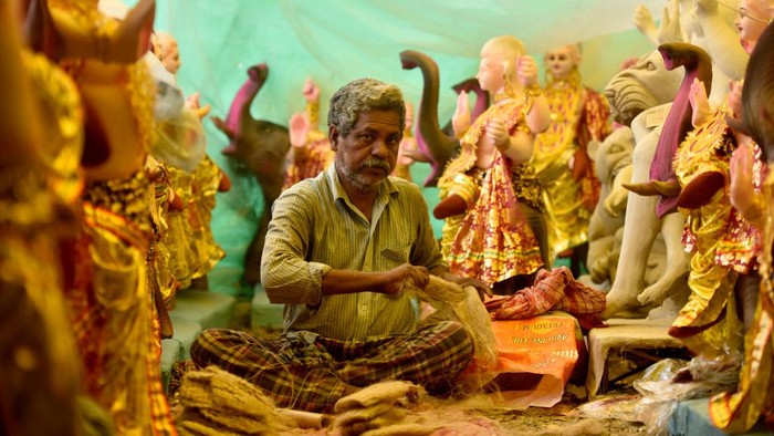 NOIDA, INDIA - SEPTEMBER 15: An artist works on idols of Vishwakarma at a workshop ahead of Vishwakarma Puja on September 15, 2022 in Noida, India. The auspicious festival of Vishwakarma Puja is celebrated with much pomp across the country. On this day, people worship Lord Vishwakarma, the son of Lord Brahma, the chief architect of the world and divine carpenter. (Photo by Sunil Ghosh/Hindustan Times via Getty Images)