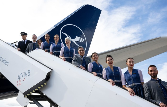 ERDING, GERMANY - SEPTEMBER 15: Flight crews of German airliner Lufthansa wear traditional Bavarian folk dress during a photocall to celebrate Oktoberfest at Munich Airport Franz-Joseph-Strauss International on September 15, 2022 in Erding, Germany. Lufthansa cabin crew will dress in the Bavarian traditional costume  