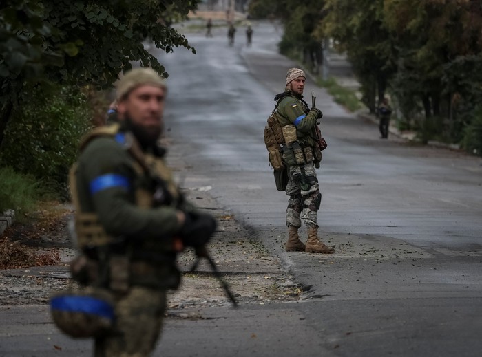 Ukrainian police patrol an area, as Russias attack on Ukraine continues, in the town of Izium, recently liberated by Ukrainian Armed Forces, in Kharkiv region, Ukraine September 14, 2022. REUTERS/Gleb Garanich