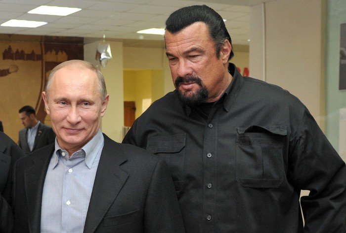 Russia's President Vladimir Putin and American action movie actor Steven Seagal visit a newly-built sports complex of Sambo-70 prominent wrestling school in Moscow. Putin teamed up today  with Steven Seagal to promote the Soviet-style regime of rigorous physical training for schoolchildren. Sambo is the official in-house martial art of the KGB security services which Putin practiced before switching to judo. AFP PHOTO/ RIA-NOVOSTI/ POOL / ALEXEI NIKOLSKY        (Photo credit should read ALEXEI NIKOLSKY/AFP via Getty Images)