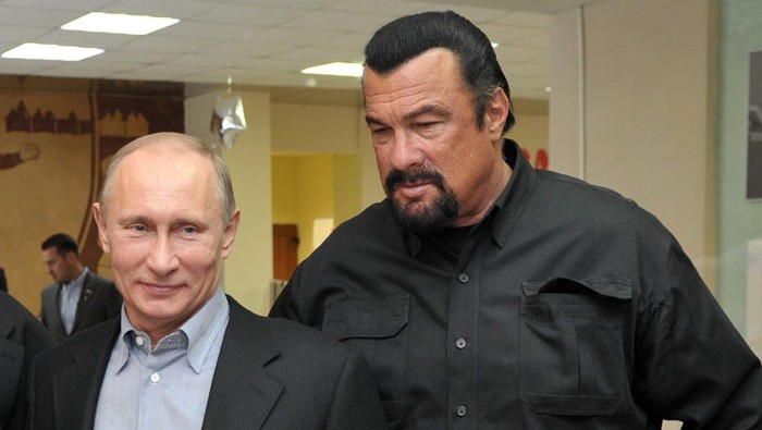 Russias President Vladimir Putin and American action movie actor Steven Seagal visit a newly-built sports complex of Sambo-70 prominent wrestling school in Moscow. Putin teamed up today  with Steven Seagal to promote the Soviet-style regime of rigorous physical training for schoolchildren. Sambo is the official in-house martial art of the KGB security services which Putin practiced before switching to judo. AFP PHOTO/ RIA-NOVOSTI/ POOL / ALEXEI NIKOLSKY        (Photo credit should read ALEXEI NIKOLSKY/AFP via Getty Images)