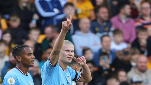 Manchester Citys Norwegian striker Erling Haaland celebrates scoring his teams second goal during the English Premier League football match between Wolverhampton Wanderers and Manchester City at the Molineux stadium in Wolverhampton, central England on September 17, 2022. - RESTRICTED TO EDITORIAL USE. No use with unauthorized audio, video, data, fixture lists, club/league logos or live services. Online in-match use limited to 120 images. An additional 40 images may be used in extra time. No video emulation. Social media in-match use limited to 120 images. An additional 40 images may be used in extra time. No use in betting publications, games or single club/league/player publications. (Photo by Geoff Caddick / AFP) / RESTRICTED TO EDITORIAL USE. No use with unauthorized audio, video, data, fixture lists, club/league logos or live services. Online in-match use limited to 120 images. An additional 40 images may be used in extra time. No video emulation. Social media in-match use limited to 120 images. An additional 40 images may be used in extra time. No use in betting publications, games or single club/league/player publications. / RESTRICTED TO EDITORIAL USE. No use with unauthorized audio, video, data, fixture lists, club/league logos or live services. Online in-match use limited to 120 images. An additional 40 images may be used in extra time. No video emulation. Social media in-match use limited to 120 images. An additional 40 images may be used in extra time. No use in betting publications, games or single club/league/player publications. (Photo by GEOFF CADDICK/AFP via Getty Images)