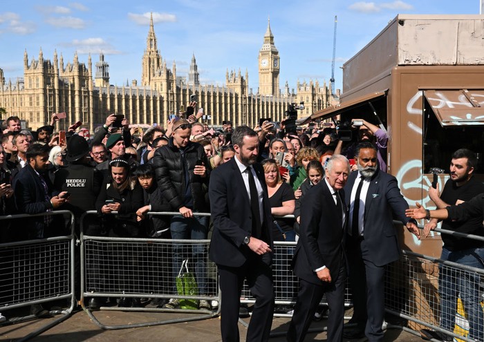 LONDON, ENGLAND - SEPTEMBER 17: King Charles III greets members of the public queueing to see the lying in state of Queen Elizabeth II along the river Thames at Lambeth. on September 17, 2022 in London, England. Earlier, His Majesty The King thanked Emergency Service workers for their work and support ahead of the funeral of Queen Elizabeth II. The Queen died at Balmoral Castle in Scotland on September 8, 2022, and is succeeded by her eldest son, King Charles III. (Photo by Karwai Tang/WireImage)