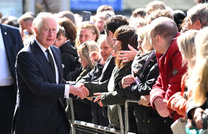 LONDON, ENGLAND - SEPTEMBER 17: King Charles III greets members of the public queueing to see the lying in state of Queen Elizabeth II along the river Thames at Lambeth. on September 17, 2022 in London, England. Earlier, His Majesty The King thanked Emergency Service workers for their work and support ahead of the funeral of Queen Elizabeth II. The Queen died at Balmoral Castle in Scotland on September 8, 2022, and is succeeded by her eldest son, King Charles III. (Photo by Karwai Tang/WireImage)