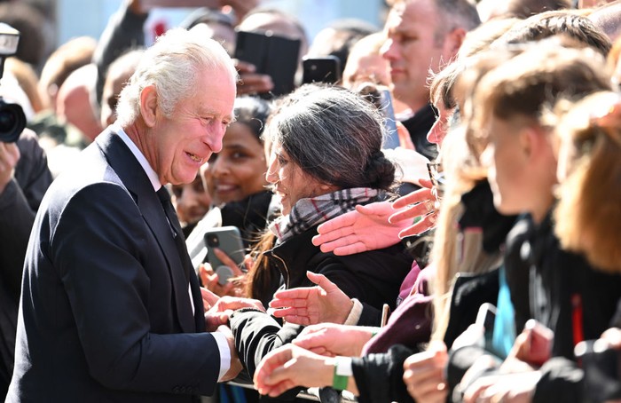 LONDON, ENGLAND - SEPTEMBER 17: King Charles III greets members of the public queueing to see the lying in state of Queen Elizabeth II along the river Thames at Lambeth. on September 17, 2022 in London, England. Earlier, His Majesty The King thanked Emergency Service workers for their work and support ahead of the funeral of Queen Elizabeth II. The Queen died at Balmoral Castle in Scotland on September 8, 2022, and is succeeded by her eldest son, King Charles III. (Photo by Karwai Tang/WireImage)