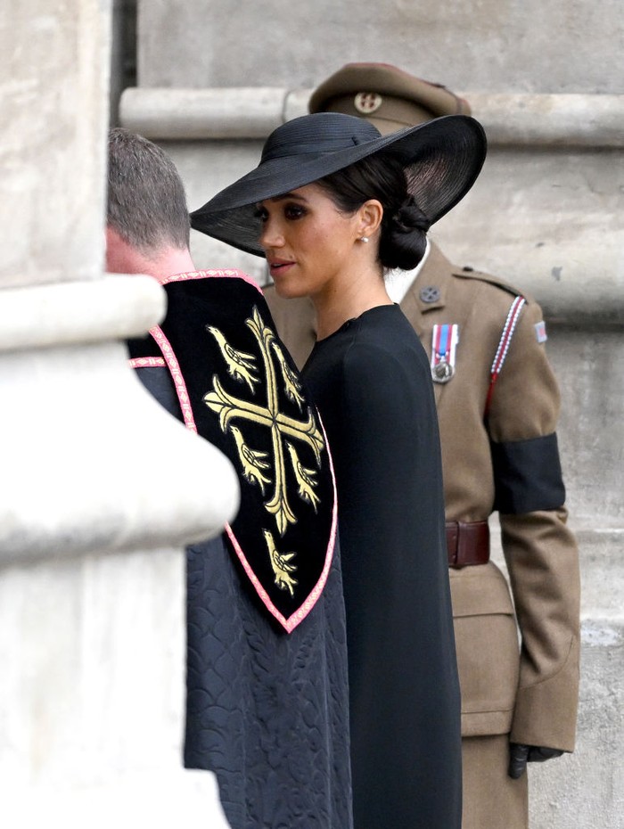 LONDON, ENGLAND - SEPTEMBER 19: Meghan, Duchess of Sussex arrives at Westminster Abbey for The State Funeral of Queen Elizabeth II on September 19, 2022 in London, England. Elizabeth Alexandra Mary Windsor was born in Bruton Street, Mayfair, London on 21 April 1926. She married Prince Philip in 1947 and ascended the throne of the United Kingdom and Commonwealth on 6 February 1952 after the death of her Father, King George VI. Queen Elizabeth II died at Balmoral Castle in Scotland on September 8, 2022, and is succeeded by her eldest son, King Charles III.  (Photo by Christopher Furlong/Getty Images)
