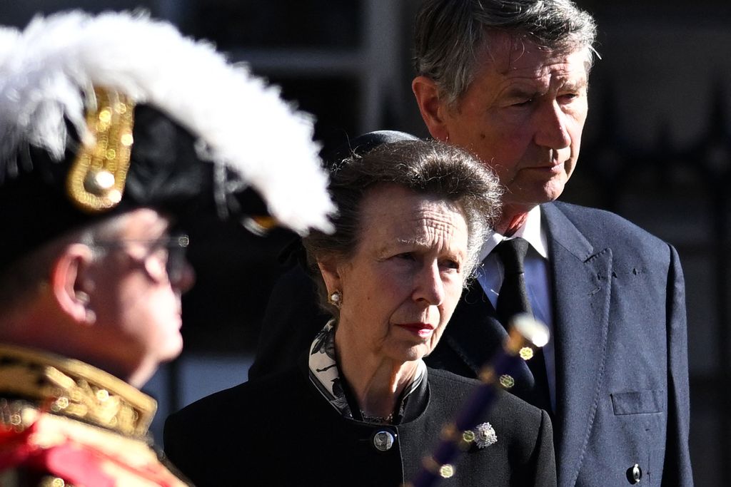 Britain's Princess Anne, Princess Royal (C) and her husband Vice Admiral Timothy Laurence leave St Giles' Cathedral in Edinburgh on September 13, 2022 to follow a hearse carrying the coffin of Queen Elizabeth II to Edinburgh airport. - Charles III on Tuesday made his maiden visit to Northern Ireland as king, as he tours all four nations of the United Kingdom before next week's state funeral of his mother Queen Elizabeth II. The casket will be flown on Tuesday evening to London, where huge crowds are expected to pay their respects as she lies in state from Wednesday evening until her funeral on Monday morning. (Photo by Oli SCARFF / AFP) (Photo by OLI SCARFF/AFP via Getty Images)