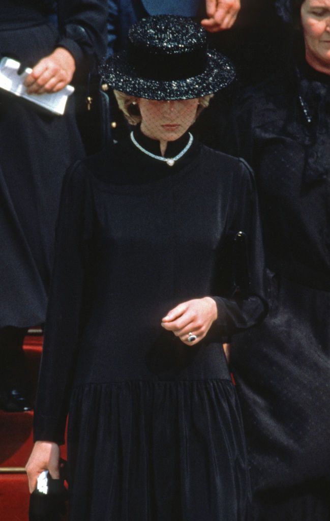 MONACO - SEPTEMBER 18: Diana, Princess of Wales, wearing a black dress and black boater hat with a netted veil and a heart shaped diamond necklace which was a gift from Prince Charles, Prince of Wales to mark the birth of Prince William,  attends the funeral of Princess Grace of Monaco on September 18, 1982 in Monaco. (Photo by Anwar Hussein/Getty Images)