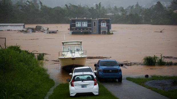 Rumah terendam banjir akibat Badai Fiona di Cayey, Puerto Rico, Minggu, 18 September 2022. (AP/Stephanie Rojas)