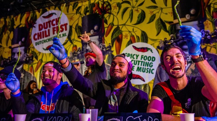 Festival Cabai Belanda Di Eindhoven Participants are showing the chili peppers before eating them, during the pepper-eating contest including in the Dutch Chili Festival organized in Eindhoven, on September 18th, 2022. (Photo by Romy Arroyo Fernandez/NurPhoto via Getty Images)