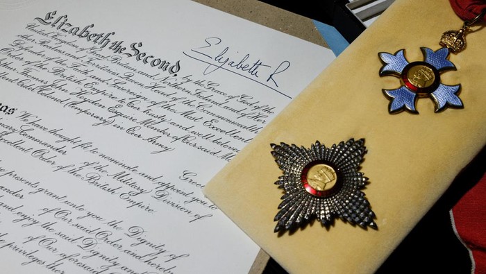 A leaflet of the coronation of Britains Queen Elizabeth is pictured at the Museum Victoria City following her death, in Hong Kong, China September 15, 2022. REUTERS/Tyrone Siu