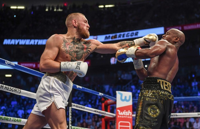 Nevada , United States - 26 August 2017; Conor McGregor, left, and Floyd Mayweather Jr during their super welterweight boxing match at T-Mobile Arena in Las Vegas, USA. (Photo By Stephen McCarthy/Sportsfile via Getty Images)