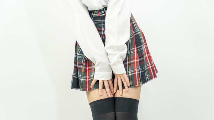 Female in mini skirt