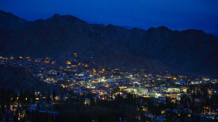 Light of the setting sun falls on the mountains as clouds partly cover a blue sky in the cold desert region of Ladakh, India, Tuesday, Sept. 20, 2022. (AP Photo/Mukhtar Khan)